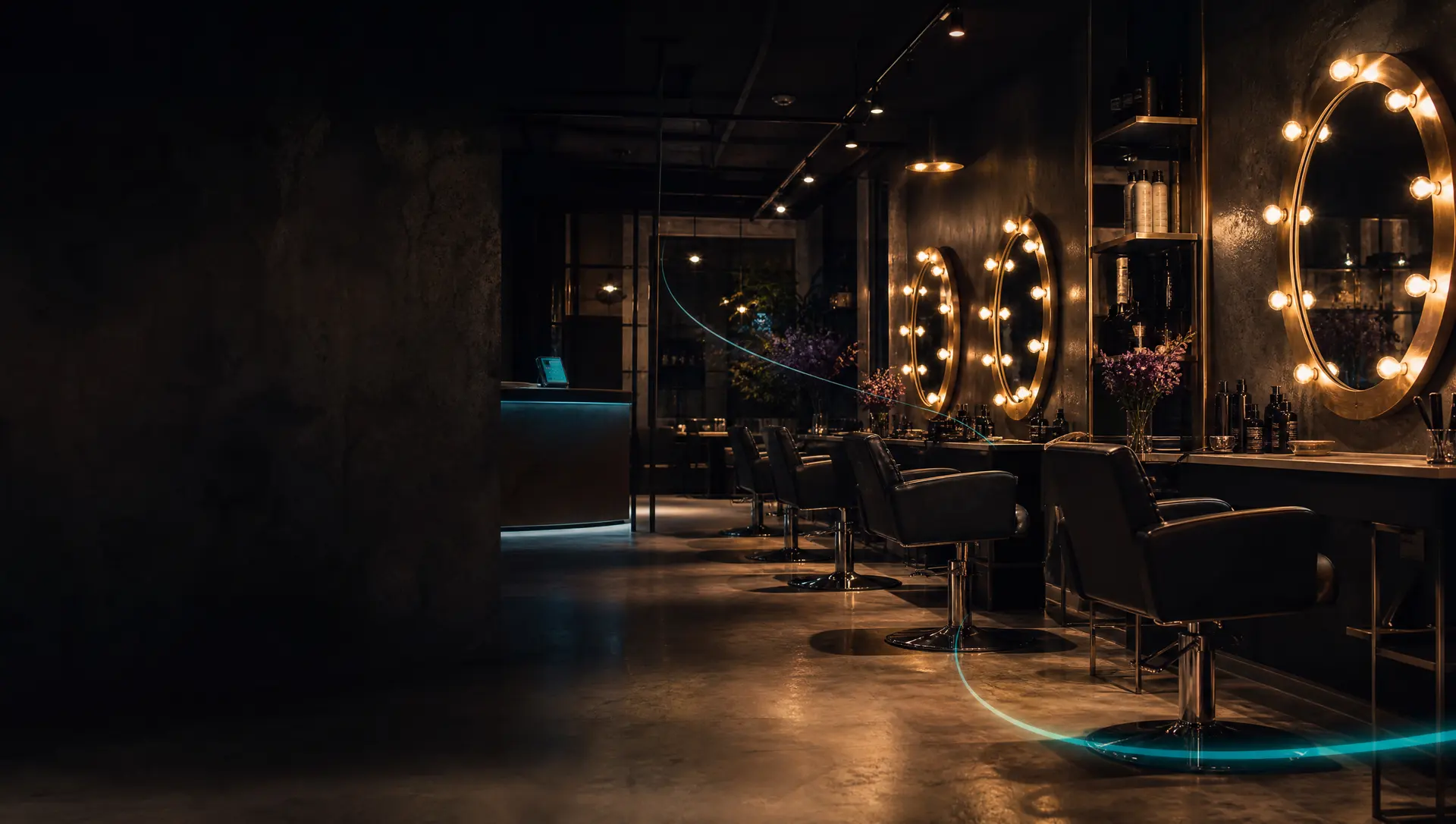 An elegant hair salon after hours with lit mirrors and a reception phone glowing teal